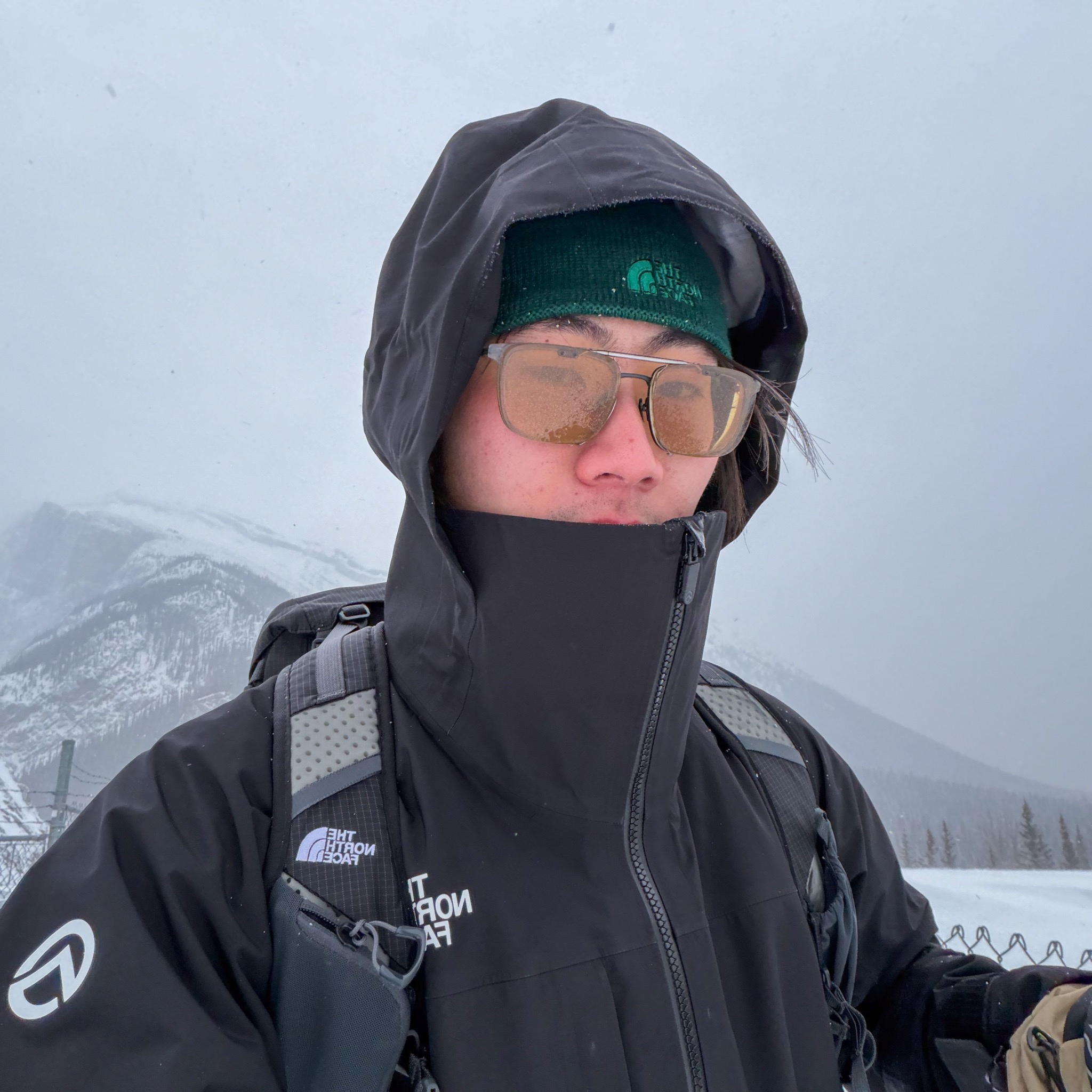 Yun Bao wearing winter hiking gear in the mountains