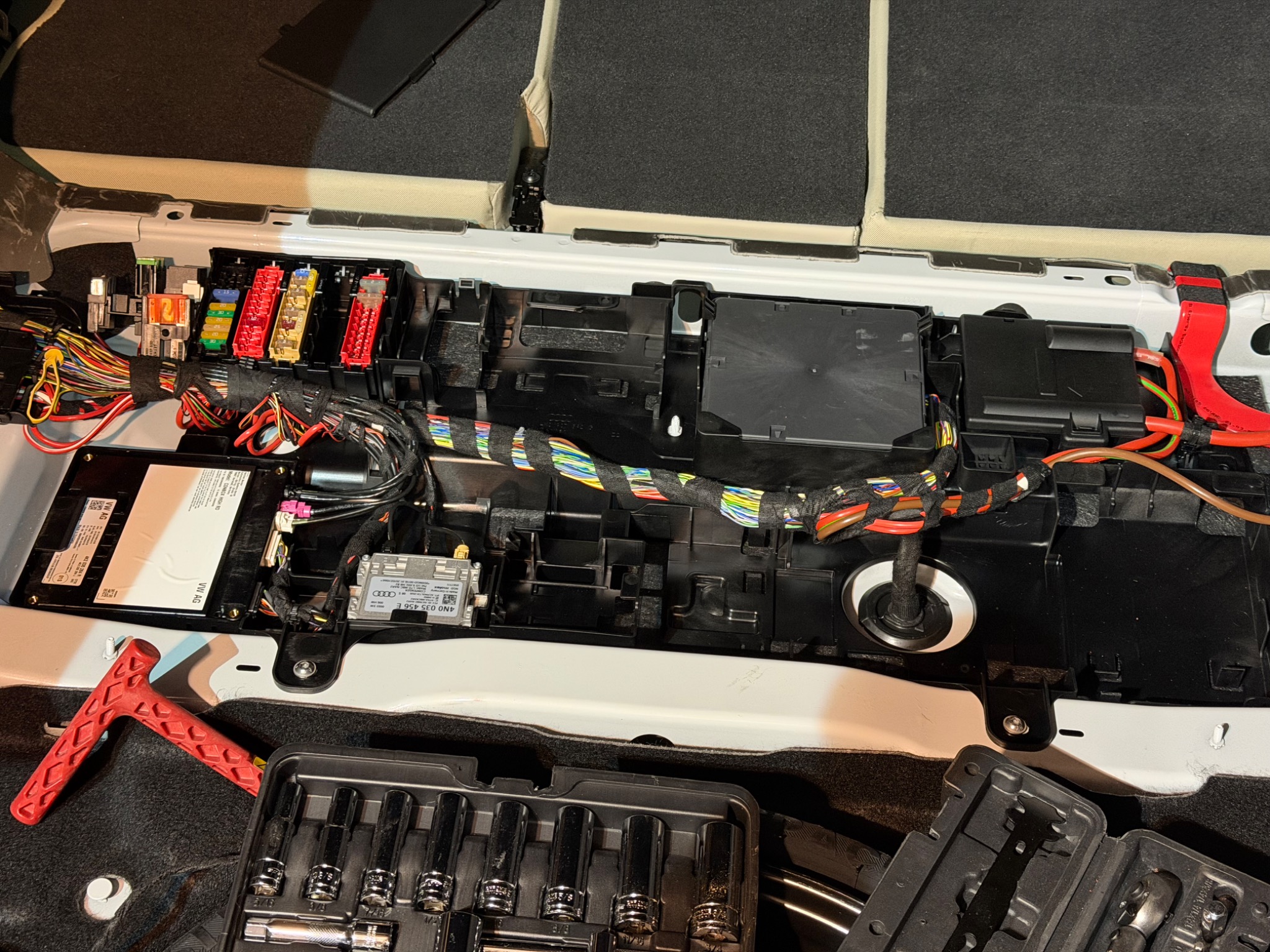A6 Allroad electrical modules and wiring exposed beneath the cargo floor