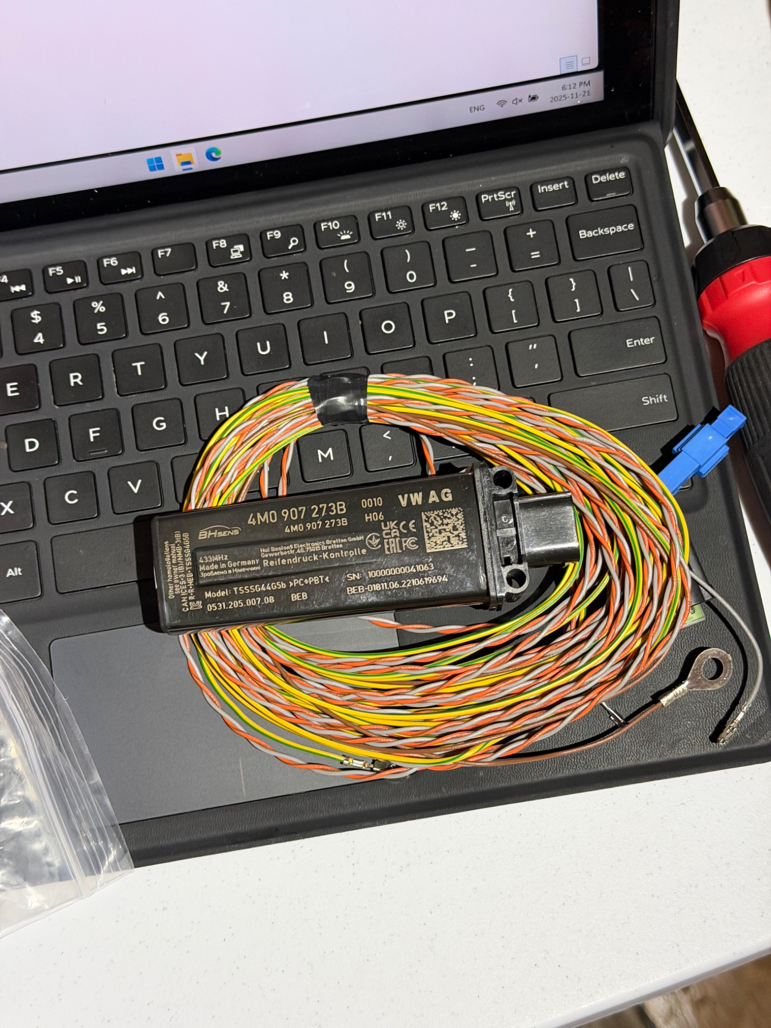 OEM Audi tire-pressure monitoring receiver with its wiring harness