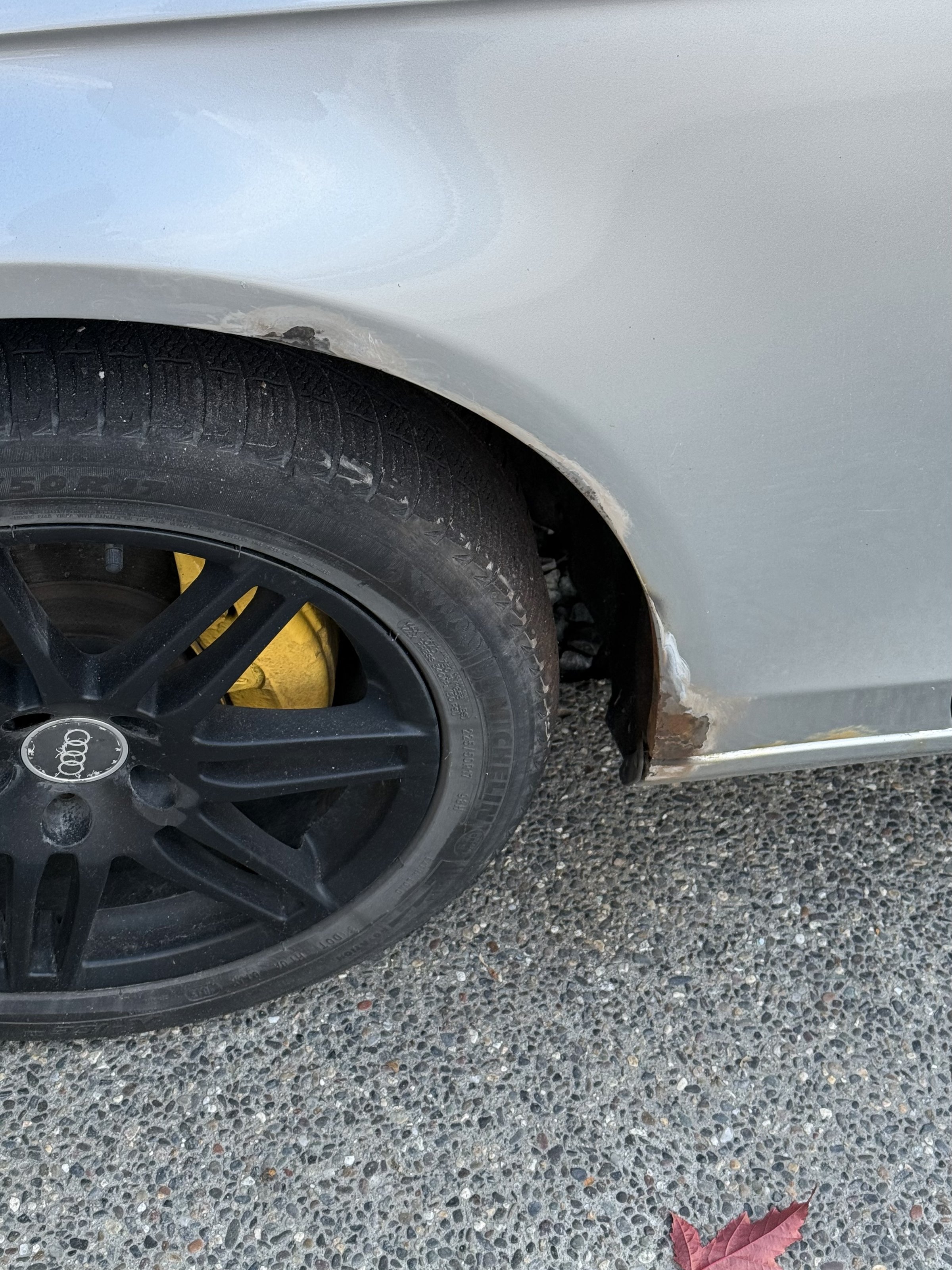 Close view of the front wheel arch before the repair