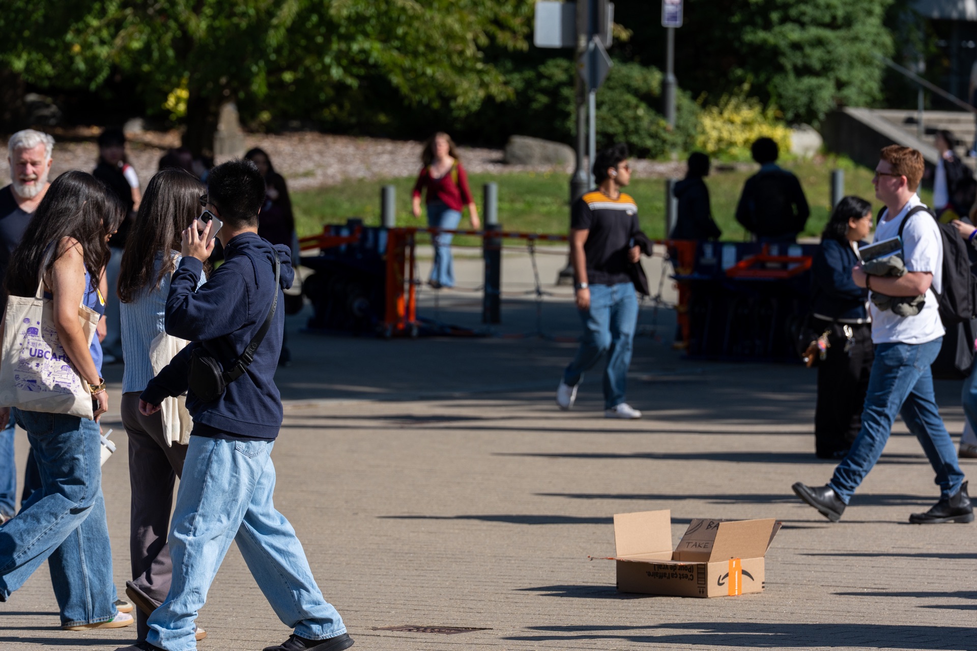 People walk past the box in the UBC plaza